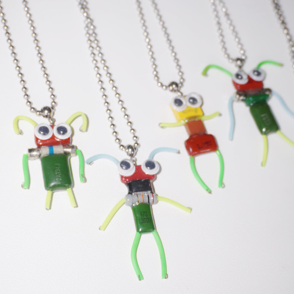 DZ010 Discarded electronic figurines with long necklaces Each one is unique