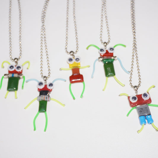 DZ010 Discarded electronic figurines with long necklaces Each one is unique